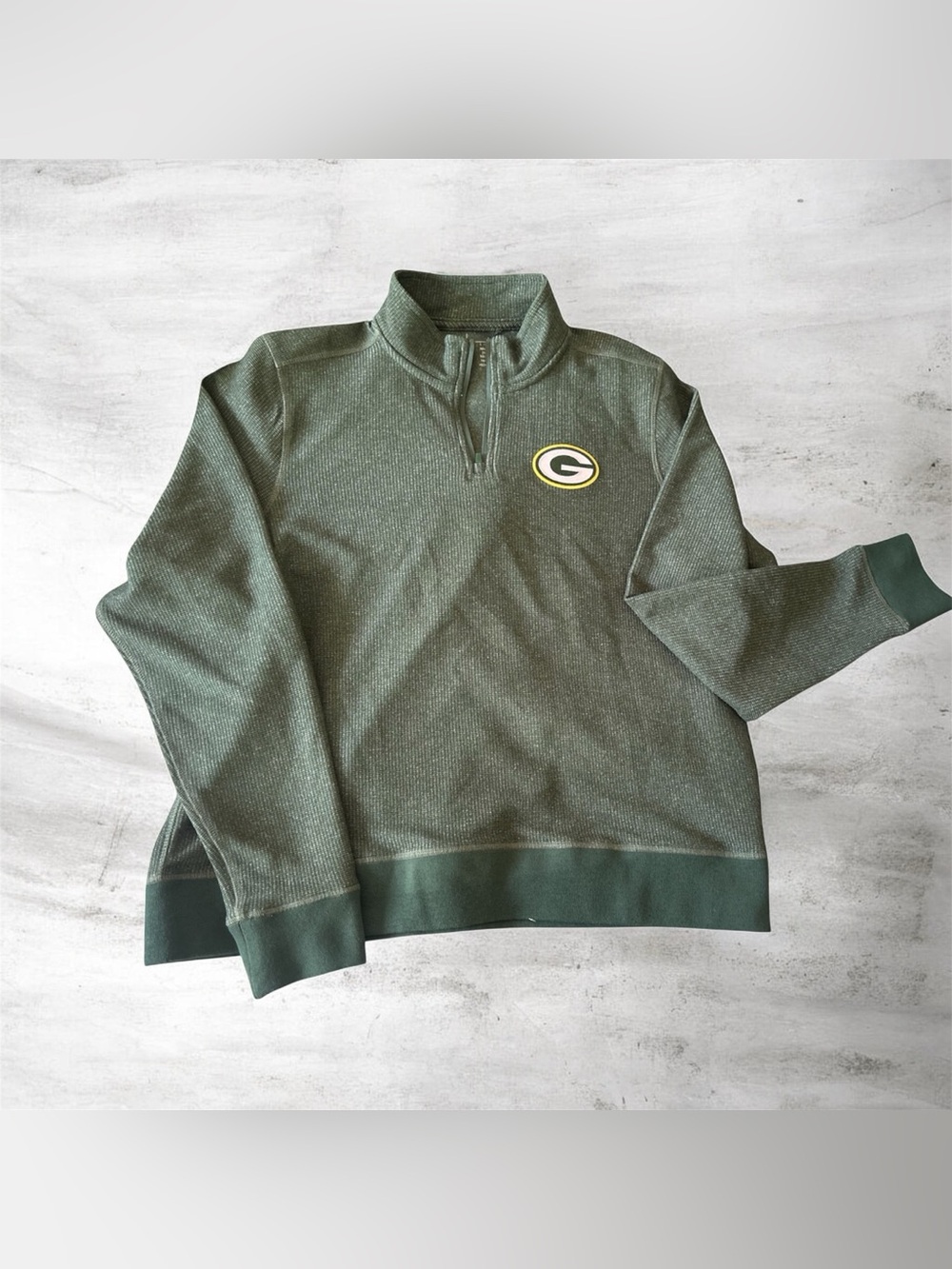 This is a Green Bay Packers Antigua Hunter Green